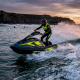 Jet ski rider navigating moderate ocean surf waves