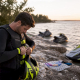 Jet ski racer wearing safety gear on marina dock