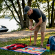 Man arranging watercraft safety gear outdoors