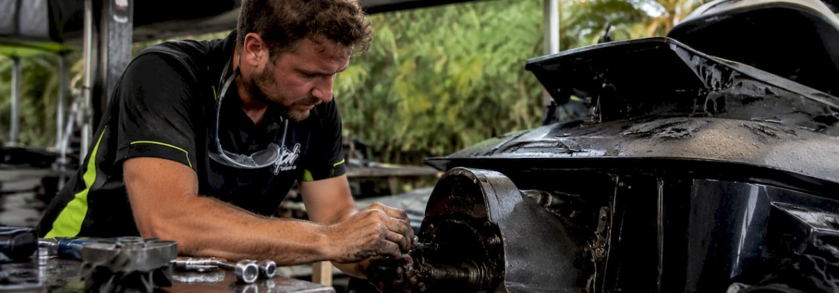 Mechanic tuning PWC pump in workshop