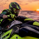 Racer on personal watercraft racing in open ocean