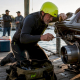 Man preparing modified jet ski for wave riding