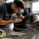 Technician inspecting carbon fiber PWC part