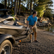 Man backing jet ski trailer on launch ramp