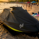 Watercraft covered with protective cover at marina