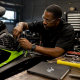 Technician installing jet ski intake grate