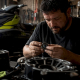 Technician inspecting jet ski bearing carrier