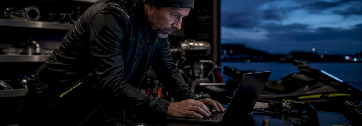 Man browsing powersports catalogs indoors