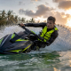 Jet ski rider executing sharp balanced turn on water