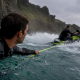 Surfer and PWC driver preparing for tow-in surfing