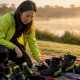 Woman examining jet ski neoprene boots outdoors