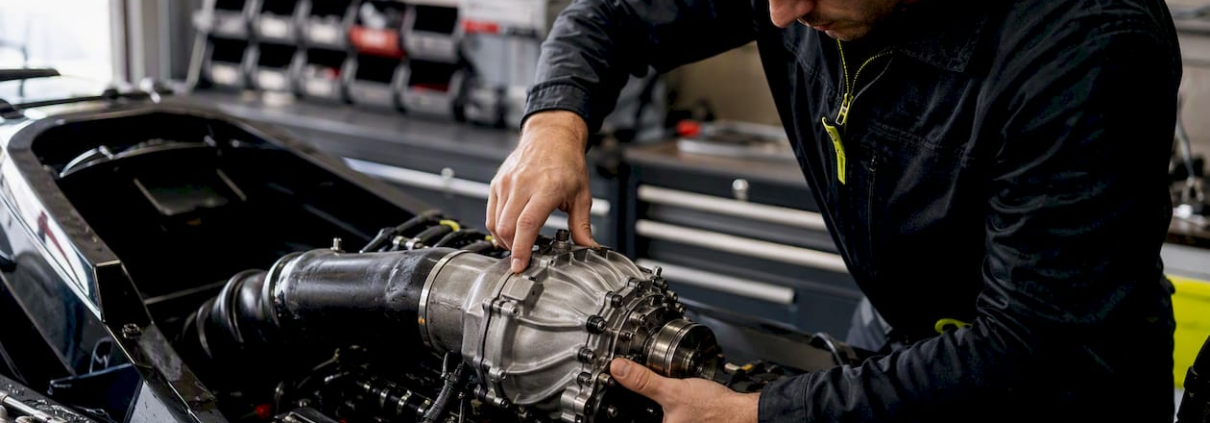 Technician installing Yamaha supercharger on PWC engine