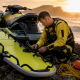 Lifeguard inspecting PWC rescue sled on beach