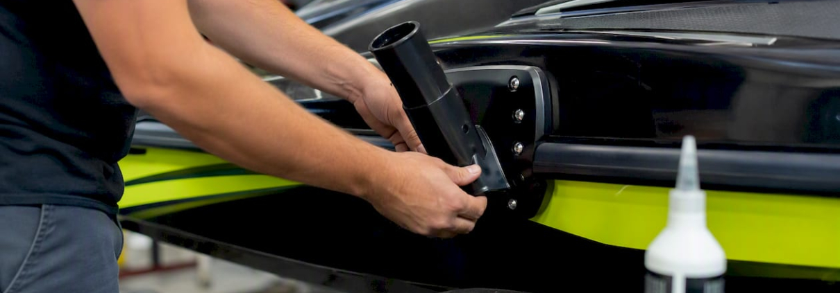 Sub-pole bracket clamped to jet ski hull