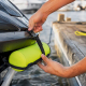 Hands attaching PWC dock bumper on hull