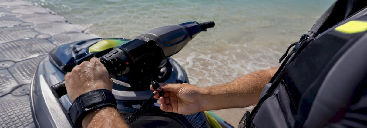 Jet ski rider performing pre-launch safety checks