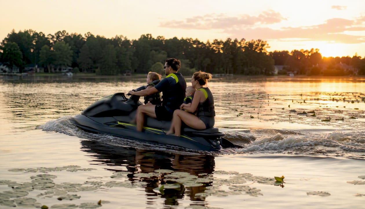 Family leisurely cruising on recreational PWC