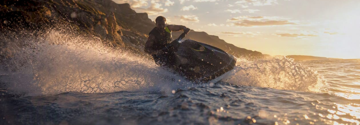 PWC free-rider carving sharply on water