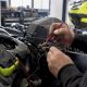 Hands testing PWC starter solenoid with multimeter