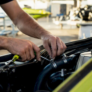 Hands maintaining jet ski cooling system parts